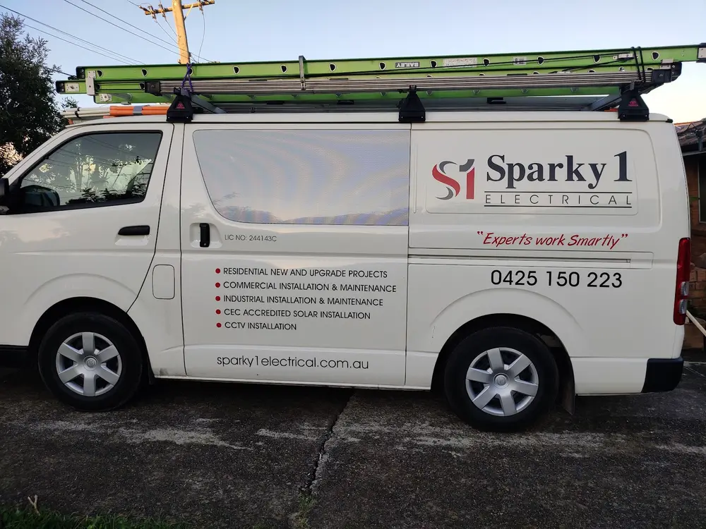Sparky 1 Electrical van showing the business name and phone number